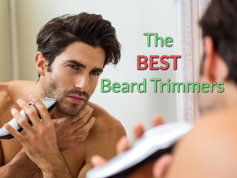 The Featured Image of the Best Beard Trimmers review article showing a man standing in front of the mirror grooming his beard with a trimmer